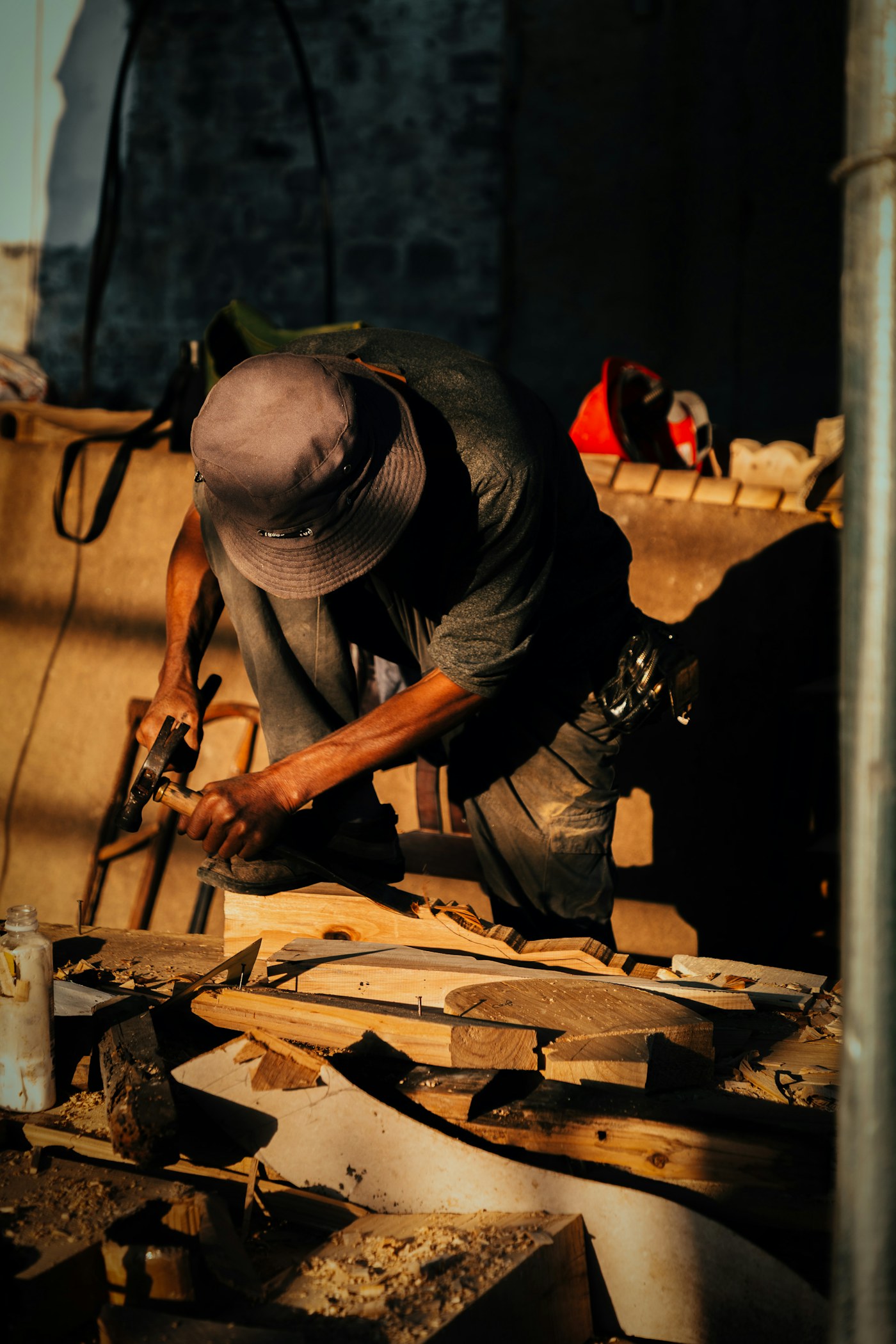 A craftsperson working with materials in a workshop